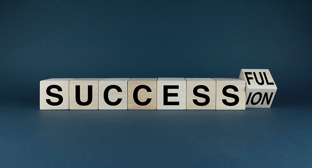 Success - Succession. Cubes form the words Successful - Succession. Business Concept